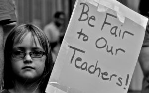 Supporter of 2012 Chicago teacher strike (cc photo: Alejandro Quinones) 