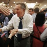 John Kasich shaking hands (photo: Chip Somodevilla/Getty)