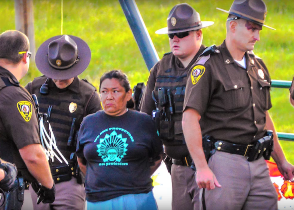 Dakota Access arrest in Neil Young's video 'Indian Givers' (screenshot: Slate)