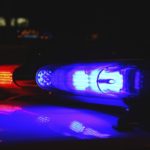 AlterNet used a Shutterstock image of police lights by Alex Schmidt to illustrate its Charlotte coverage.