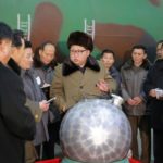 Photo of Kim Jong Un with bomb from Korean Central News Agency reprinted by New York Times