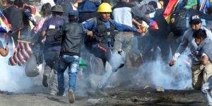 NewsHour depicition of Morales supporters being tear-gassed in a "clash." (photo: Danilo Balderrama/Reuters)