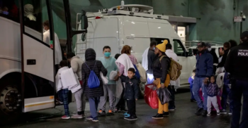 New York Times photo of immigrants in New York.