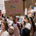 New York Times depiction of critics of an anti-trans school board resolution.