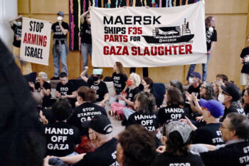 Palestinian Youth Movement and Jewish Voice for Peace protesters at the headquarters of Maersk, a shipping firm that helps support the Gaza genocide.