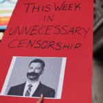 Protest sign featuring Jimmy Kimmel: 'This Week in Unnecessary Censorship'