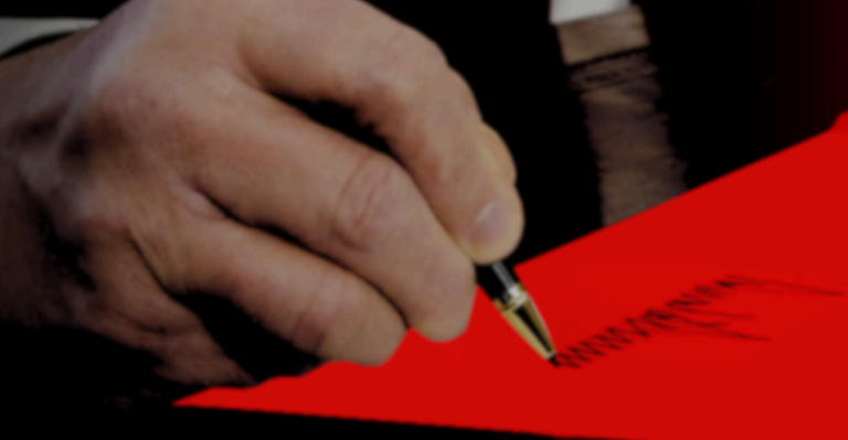 Donald Trump's hand signing his name, from the AAPF report Anti-Blackness Is the Point