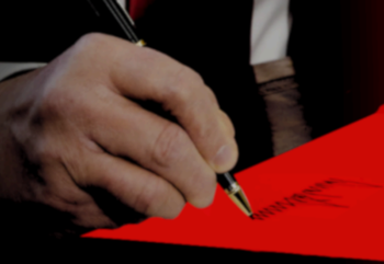 Donald Trump's hand signing his name, from the AAPF report Anti-Blackness Is the Point