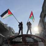 The Nation's depiction of two people waving Palestinian flags in Gaza. (photo: Ferial Abdu / Anadolu via Getty Images)