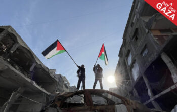 A Day for Gaza: Image of two people with Palestinian flags from The Nation's special issue