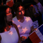 Screenshot of New York Times article image of two candidate supporters